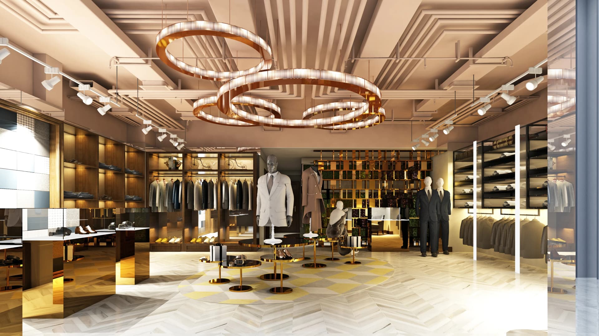 Un intérieur de boutique de mode masculine sophistiqué présente des mannequins en costumes, des rangées de vêtements, des chaussures et des accessoires sur des présentoirs en bois et dorés. Le design moderne est mis en valeur par de grands lustres circulaires lumineux, un éclairage sur rail et un sol à motif chevrons avec un tapis géométrique.
